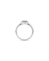 Halo Ring with Tanzanite & 0.15 Carat TW Of Diamonds in 10kt White Gold