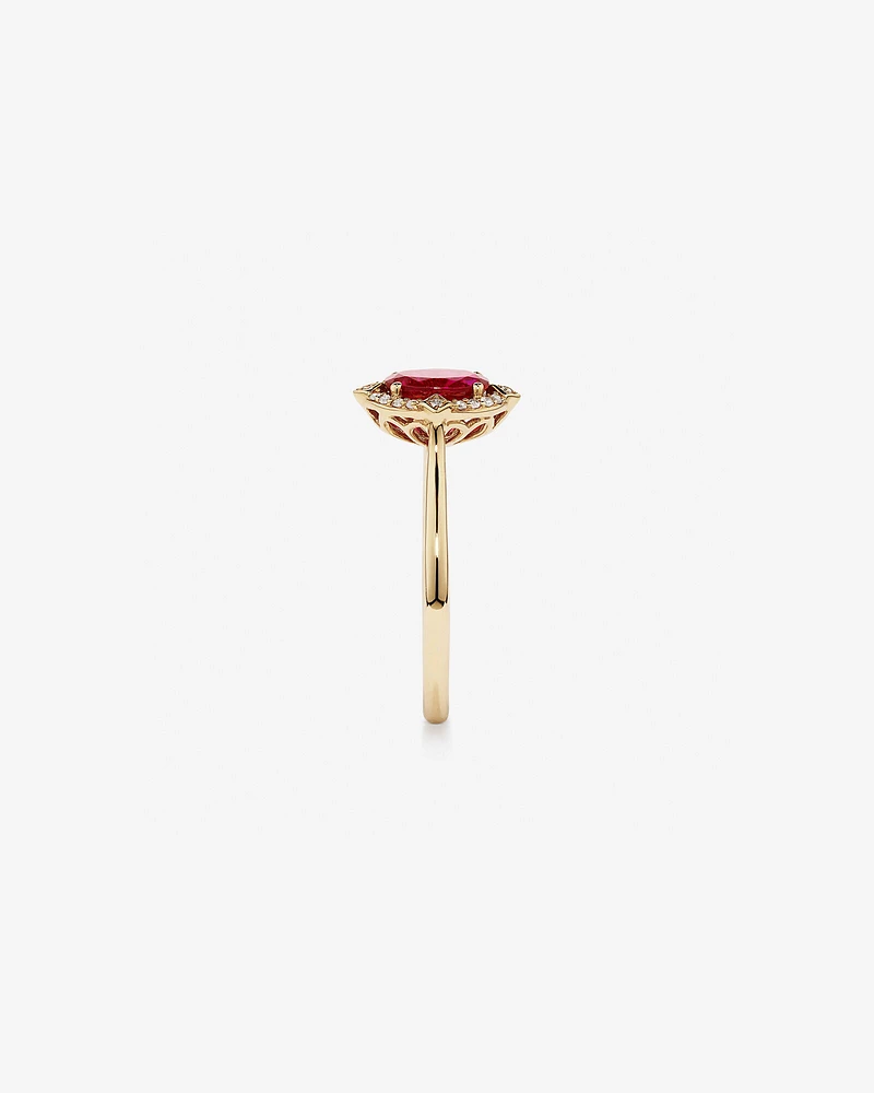 Oval Cut Created Ruby and Diamond Halo Ring in 10kt Yellow Gold