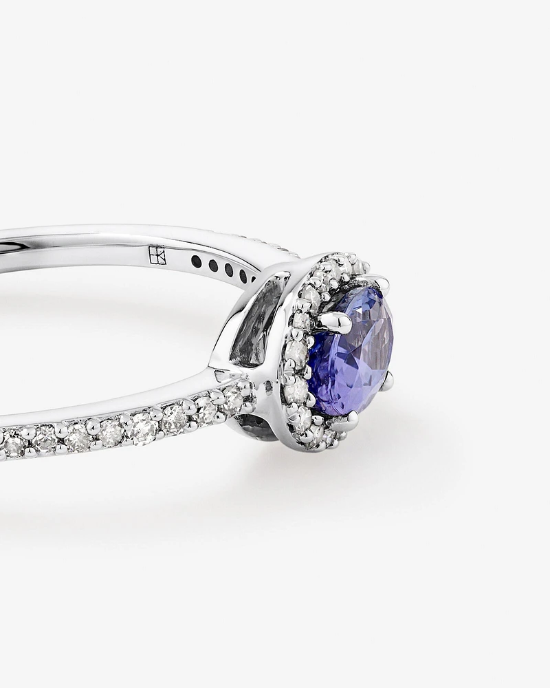 Oval Cut Blue Tanzanite Gemstone and 0.15 Carat TW Diamond Halo East West Ring in 10kt White Gold