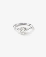 1.10 Carat TW Three Stone Oval and Pear Hidden Halo Engagement Ring in Platinum