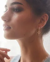 Jae Star Gold Huggie Earrings in White Crystal