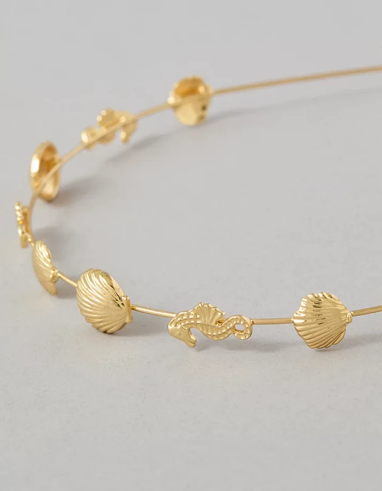 Bandeau orné d’un coquillage doré AE