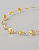 Bandeau orné d’un coquillage doré AE