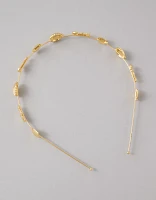 Bandeau orné d’un coquillage doré AE