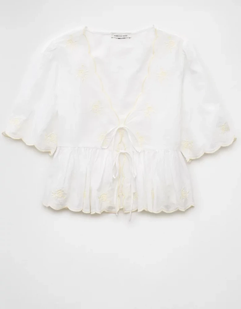 Blouse avec encolure en V nouée à l’avant brodée AE