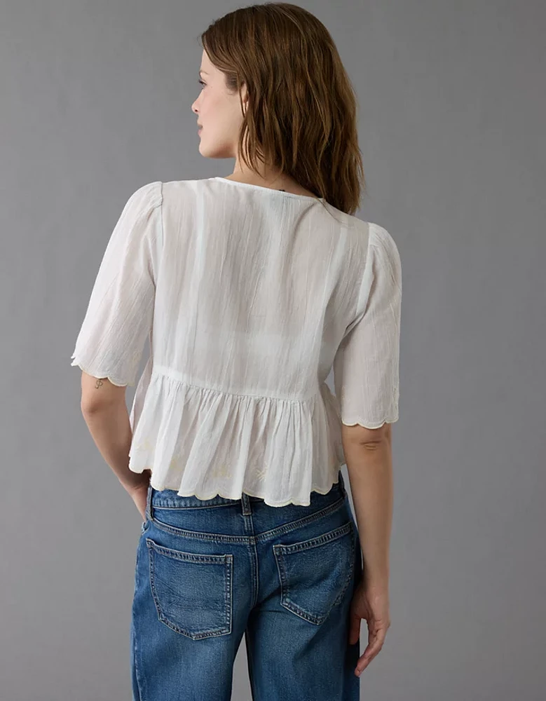 Blouse avec encolure en V nouée à l’avant brodée AE