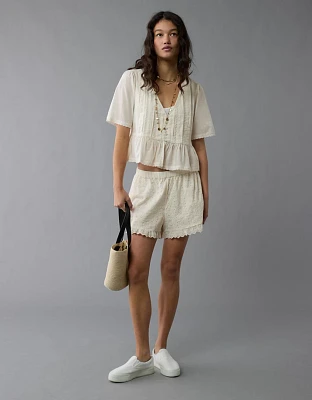 Short à taille haute et œillets avec volants AE