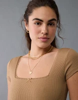 Justaucorps à boucle et décolleté carré manches courtes AE