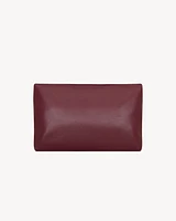 CASSANDRE large envelope pouch in shiny leather