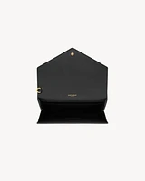 CASSANDRE flap pouch in crocodile-embossed shiny leather