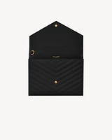 CASSANDRE MATELASSÉ FLAP POUCH in grain de poudre leather