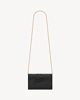 Uptown chain wallet in shiny crocodile-embossed leather