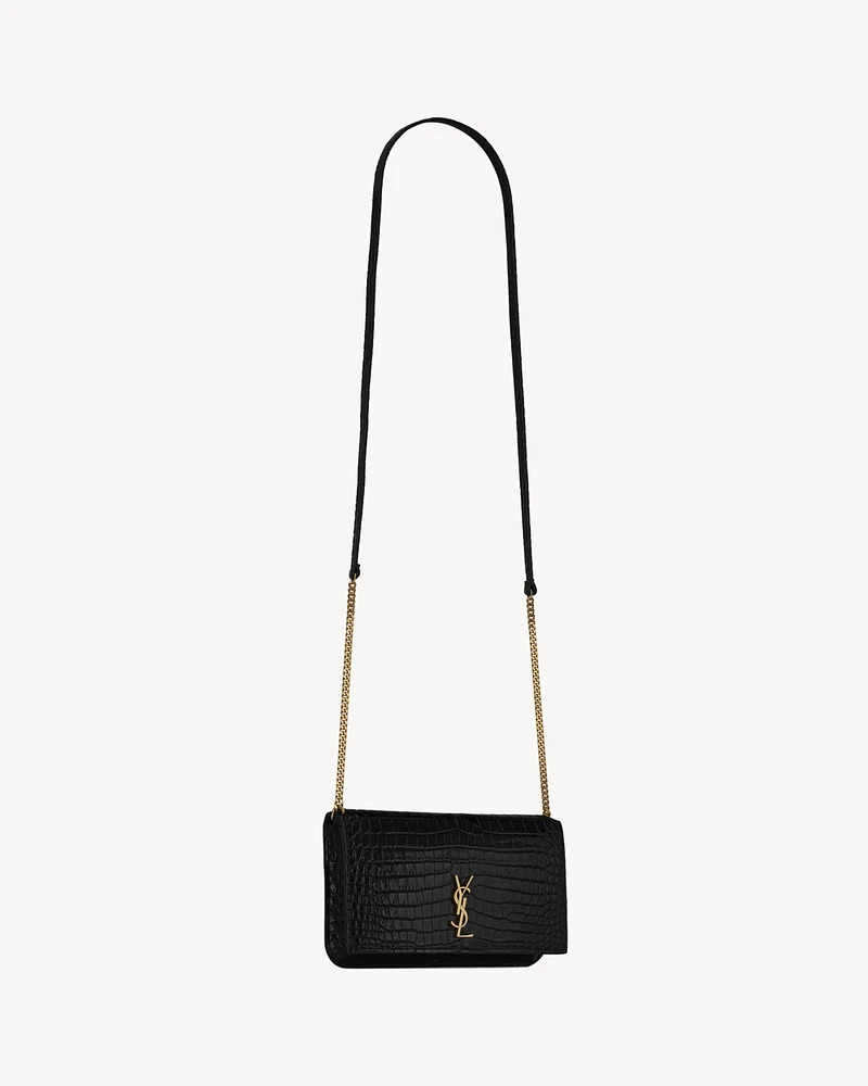 CASSANDRE phone holder in SHINY crocodile-embossed leather