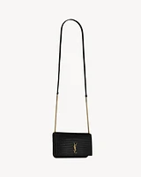 CASSANDRE phone holder in SHINY crocodile-embossed leather
