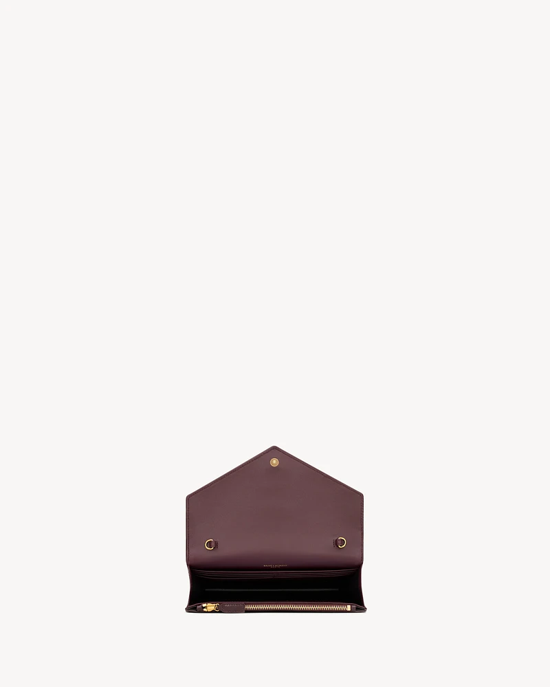 CASSANDRE envelope chain wallet in patent leather