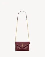 CASSANDRE chain pouch in shiny leather