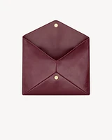 CASSANDRE large envelope pouch in shiny leather