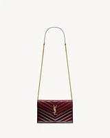 CASSANDRE envelope chain wallet in patent leather