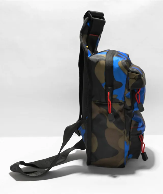 https://cdn.mall.adeptmind.ai/https%3A%2F%2Fscene7.zumiez.com%2Fis%2Fimage%2Fzumiez%2Fproduct_main_medium_2x%2FCookies-Rackpack-Smell-Proof-Blue-Camo-Crossbody-Bag-_362825-alt1-US.jpg_640x.webp