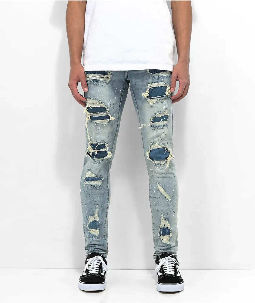 Denim trousers with rips