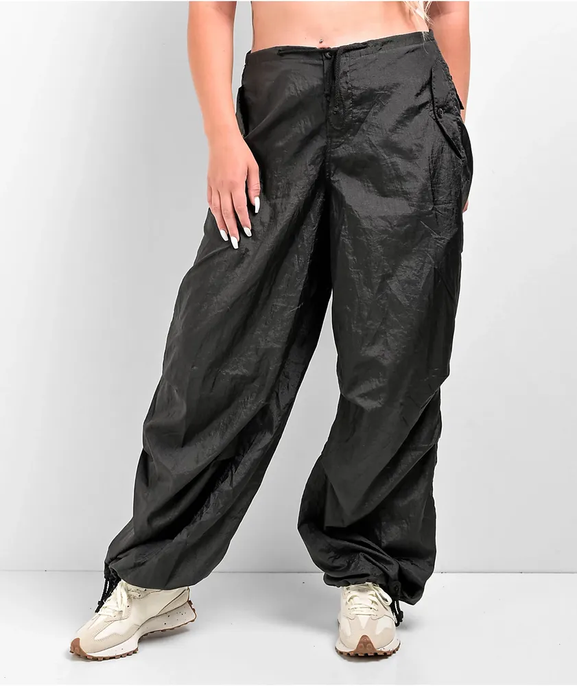 Parachute pants adjustable at the waist and ankles