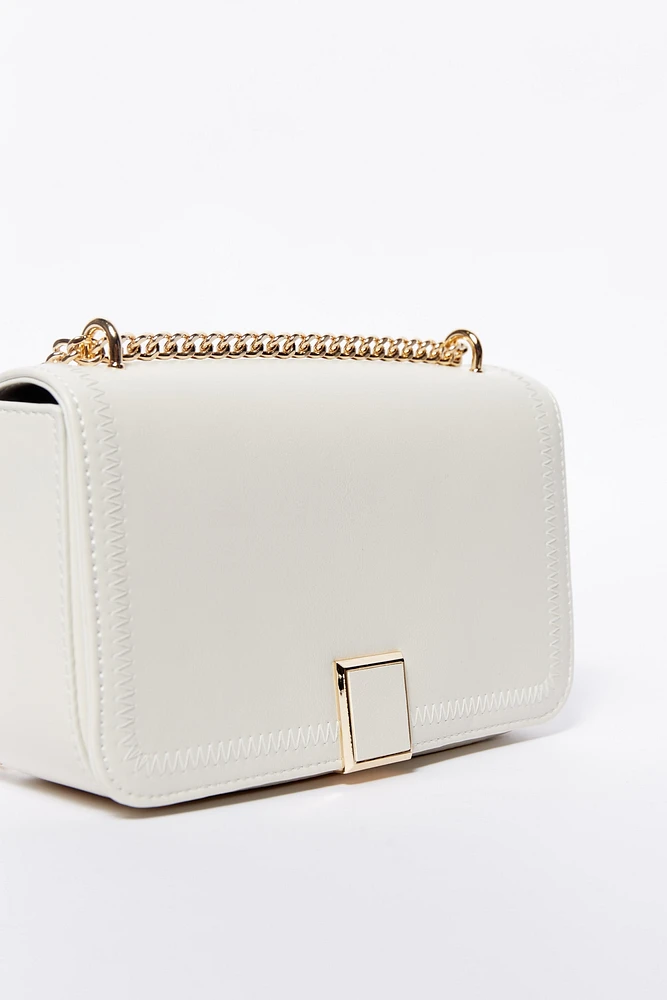 Crossbody solapa broche