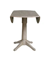 International Concepts 42" Round Dual Drop Leaf Pedestal Table
