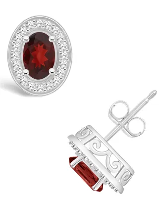 Macy's Garnet (1-1/6 ct. t.w.) and Diamond (1/5 ct. t.w.) Halo Studs in Sterling Silver