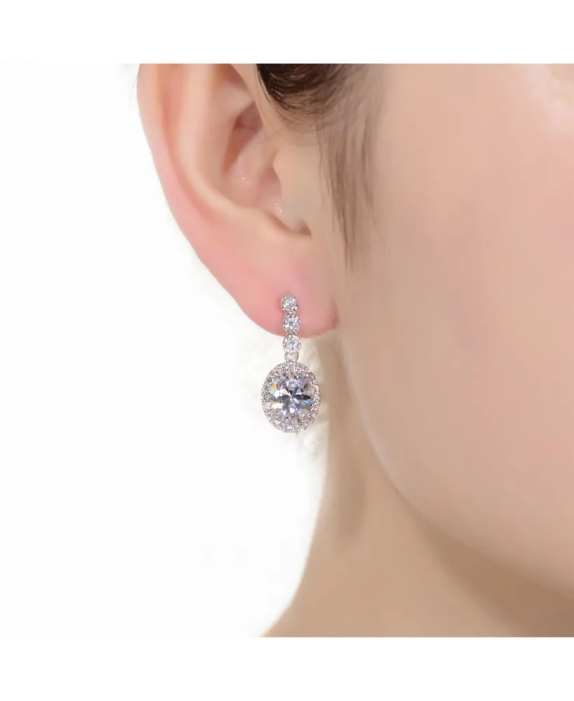 Genevive Sterling Silver with Rhodium Plated Clear Oval and Round Cubic Zirconia Halo Drop Earrings