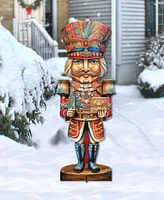 Designocracy Nutcracker with a Heartwarming Surprise 32" Outdoor Holiday Lawn Decor G. DeBrekht