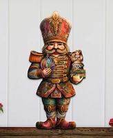 Designocracy Clara and Nutcracker Prince Christmas Door Hanger Wooden Door Decor G. DeBrekht