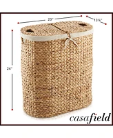 Casafield Oval Laundry Hamper with Lids and Removable Liner Bags - Natural, Woven Water Hyacinth 2-Section Laundry Basket for Clothes and Towels