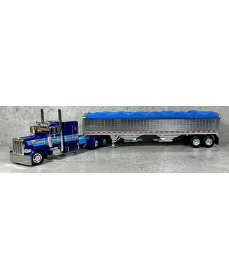 Dcp 1/64 Dark Blue Peterbilt 389 63in Flattop w/ Wilson Grain Trailer