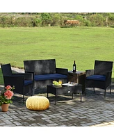 Sugift 4 Pieces Patio Rattan Cushioned Sofa Set with Tempered Glass Coffee Table-Navy & Off White
