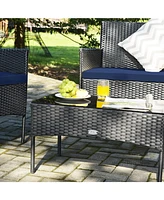 Sugift 4 Pieces Patio Rattan Cushioned Sofa Set with Tempered Glass Coffee Table-Navy & Off White