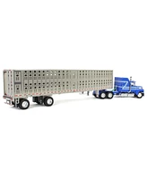 First Gear 1/64 Blue Ford Ltl 9000 60in Aerodyne Sleeper & Wilson Livestock Trailer