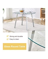 Table and chair set.a Modern Minimalist Style Round Clear Tempered Glass Table with silver Metal Legs.Paired with 6 chairs with Modern Pu Leather High