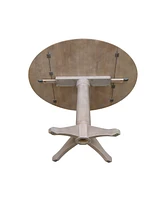 International Concepts 42" Round Dual Drop Leaf Pedestal Table