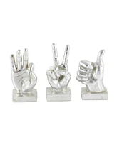 CosmoLiving by Cosmopolitan Set of 3 Silver Polystone Traditional Hand Sculpture, 7", 7", 6"
