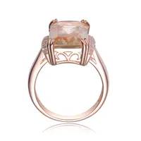 Genevive Sterling Silver with Rose Gold Plated Champagne Radiant Cubic Zirconia Solitaire Accented with Clear Round Cubic Zirconias Cocktail Ring