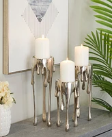 CosmoLiving Aluminum Abstract Pillar Drip Candle Holder with Melting Designed Legs Set of 3 - 12", 10", 8" H