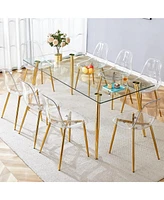 Simplie Fun Table and chair set.Modern rectangular glass dining table with tempered glass countertop and golden metal legs, paired with multiple trans