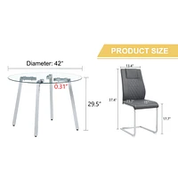Table and chair set.a Modern Minimalist Style Round Clear Tempered Glass Table with silver Metal Legs.And 4 dark gray chairs with Modern Pu Leather Hi