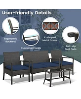 Sugift 4 Pieces Rattan Conversation Set with Tempered Glass Coffee Table