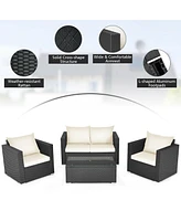 Gouun 4 Pieces Patio Rattan Conversation Set with Padded Cushion and Tempered Glass Table