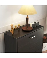 The black 2-door wooden shoe cabinet and fashionable shutter door design, sturdy and durable, efficient and stored, and enhance the aesthetics of the