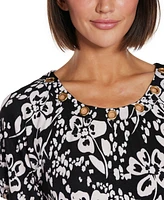 Belldini Women's Grommet Detail Floral Short Sleeve Knit Top