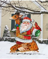 Designocracy Santa on Giraffe Free Standing Garden Decor