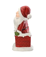 National Tree Company 14" Santa Climbing into Chimney Figurine