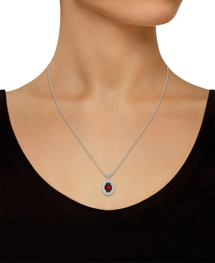 Macy's Garnet (1-1/2 ct. t.w.) and Diamond (1/8 ct. t.w.) Halo Pendant Necklace in Sterling Silver